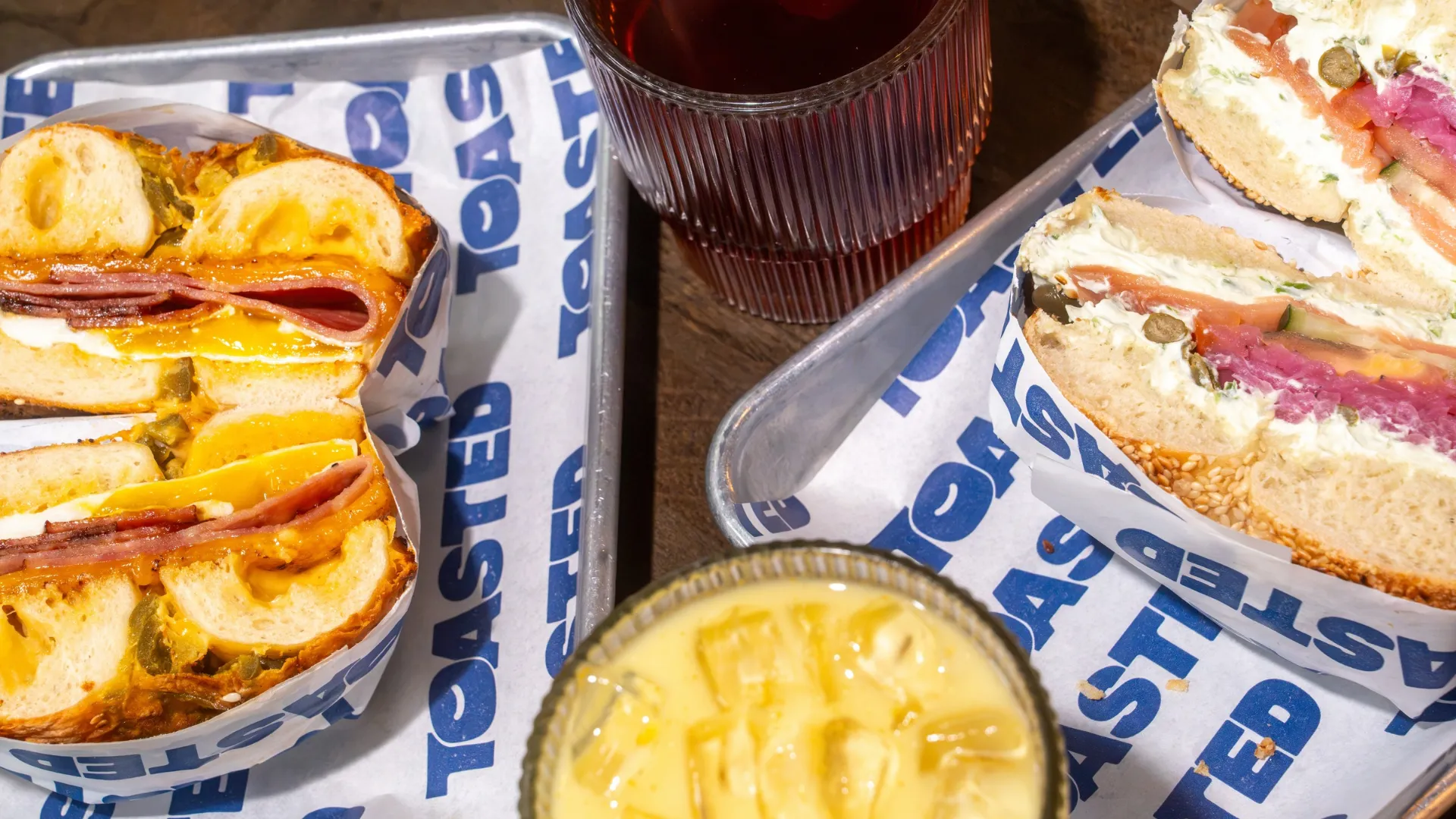TOASTED bagel sandwiches and iced coffee